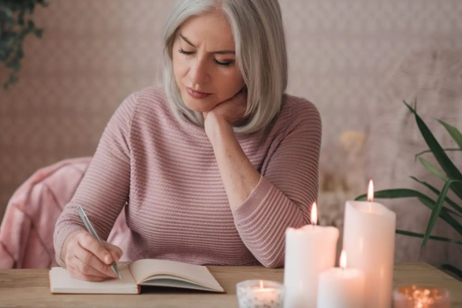 older lady writing in a journal