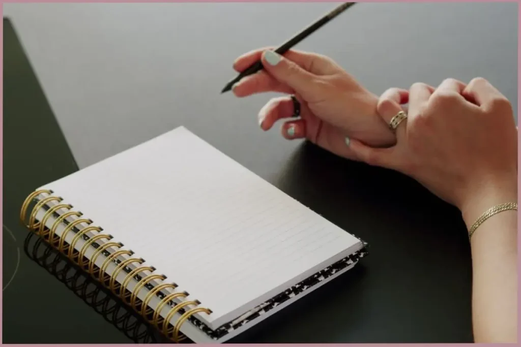 lady writing in journal to help ease the transition to empty nester