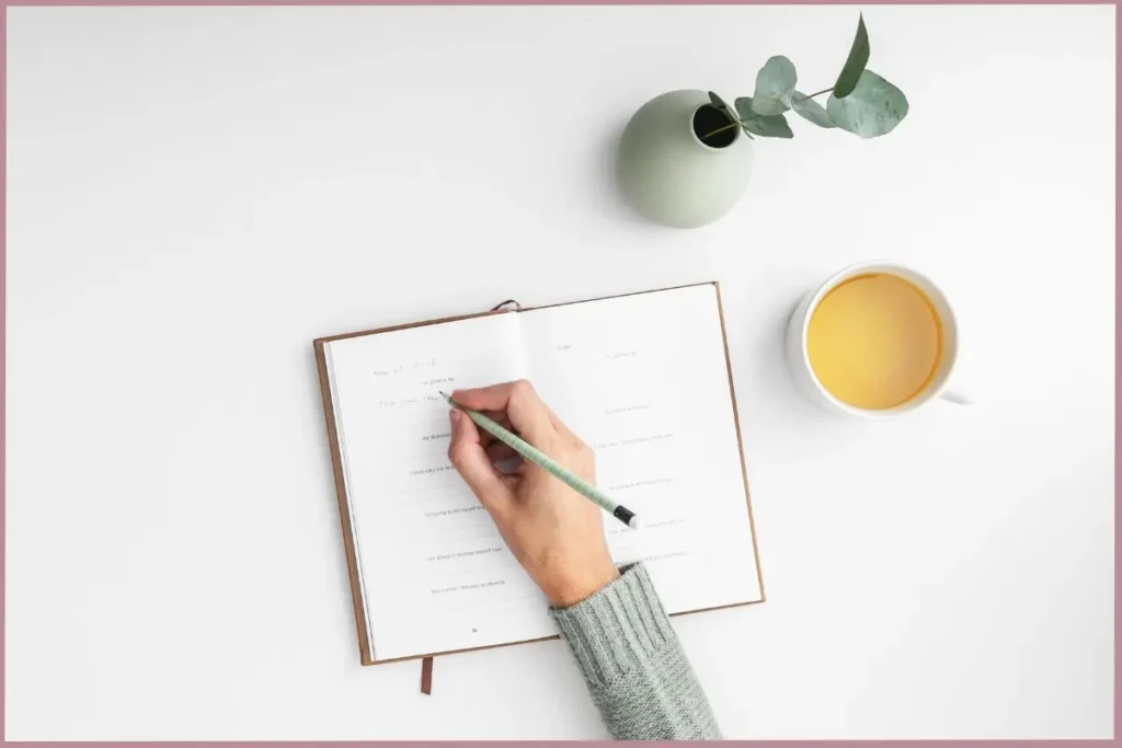 lady writing in a journal - discover how self-discovery journaling helps empty nester moms