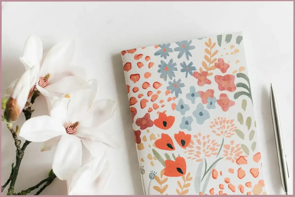 journal with floral pattern on cover- journaling guide for empty nester moms