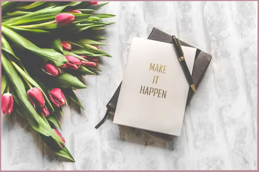 Journal with the words 'make it happen' for empty nesters