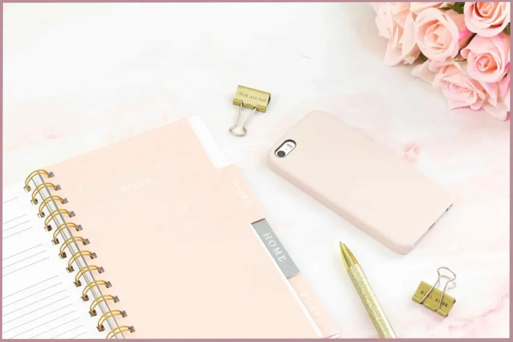 blush colored journal with tips on how to maintain your journaling practice