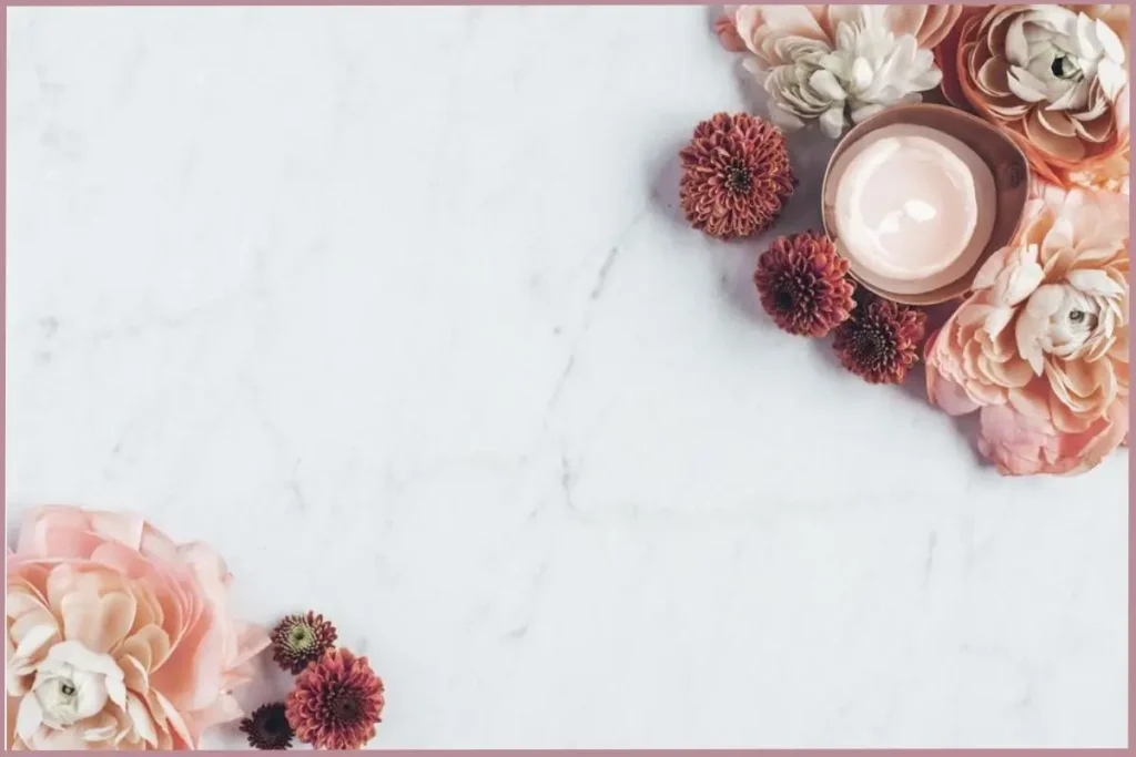 candle surrounded by flowers - creative self care ideas for empty nesters