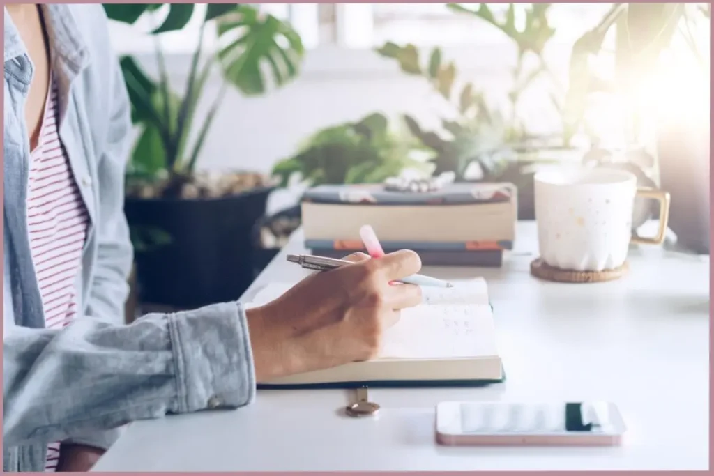 lady writing in journal - stream of consciousness writing vs traditional journaling