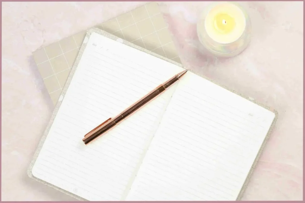pen lying on top of open journal - what is stream of consciousness writing
